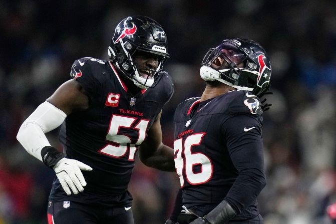 Houston Texans defensive end Denico Autry celebrates with Will Anderson Jr. after sacking Los Angeles Chargers quarterback Justin Herbert during the second half of a wild-card playoff game Saturday, January 11, in Houston. The Texans won 32-12 and advance to the divisional round.