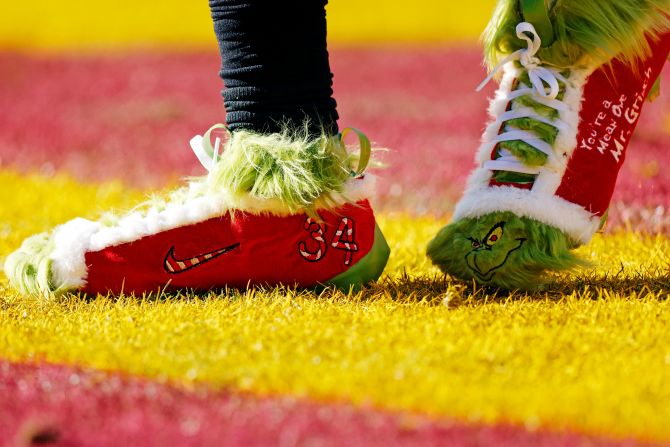 Philadelphia Eagles cornerback Isaiah Rodgers wears Grinch-themed cleats while warming up ahead of his team's game against the Washington Commanders in Landover, Maryland, on December 22. The Commanders beat the Eagles 36-33.