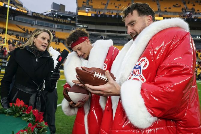 Kansas City Chiefs quarterback Patrick Mahomes and tight end Travis Kelce eat football-shaped cake after a 29-10 win against the Pittsburgh Steelers in Pittsburgh on December 25. Mahomes broke Peyton Manning's record for the most career touchdown passes in the first eight seasons of playing in the league with 245.