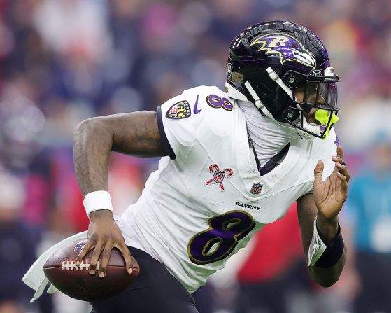 Baltimore Ravens quarterback Lamar Jackson runs the ball against the Houston Texans in Houston on Wednesday, December 25. The Ravens won 31-2, with Jackson breaking the record for the most rushed yards by a quarterback, beating out Michael Vick's record.