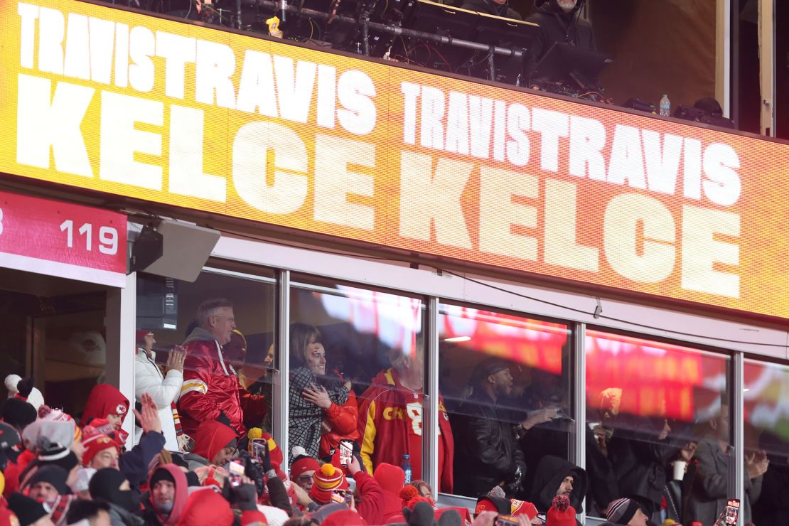 Taylor Swift hugs Caitlin Clark, right, as they celebrate with Swift's father, Scott Swift, left, following a touchdown by Kansas City Chiefs tight end Travis Kelce.