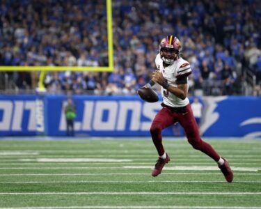 Jameson Williams #9 of the Detroit Lions runs the ball for a touchdown during the second quarter against the Washington Commanders in the NFC Divisional Playoff.