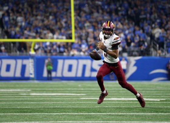 Jameson Williams #9 of the Detroit Lions runs the ball for a touchdown during the second quarter against the Washington Commanders in the NFC Divisional Playoff.