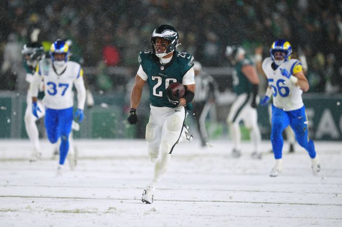 Philadelphia Eagles running back Saquon Barkley runs the ball for a touchdown during a NFC divisional playoff game against the Los Angeles Rams in Philadelphia on January 19. Barkley had 205 rushing yards and touchdown runs of 62 and 78 yards in the game. The Eagles won 28-22 and will take on the Washington Commanders in the NFC Championship.