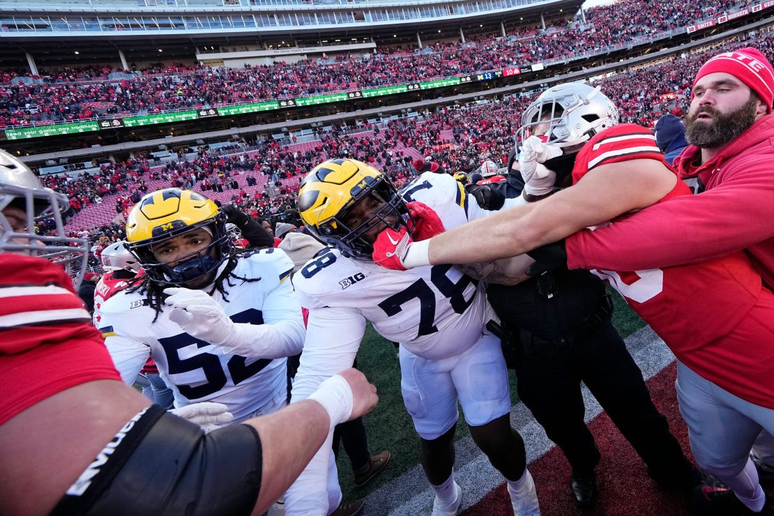 Michigan Wolverines and Ohio State Buckeyes fight following the game at Ohio Stadium in Columbus.