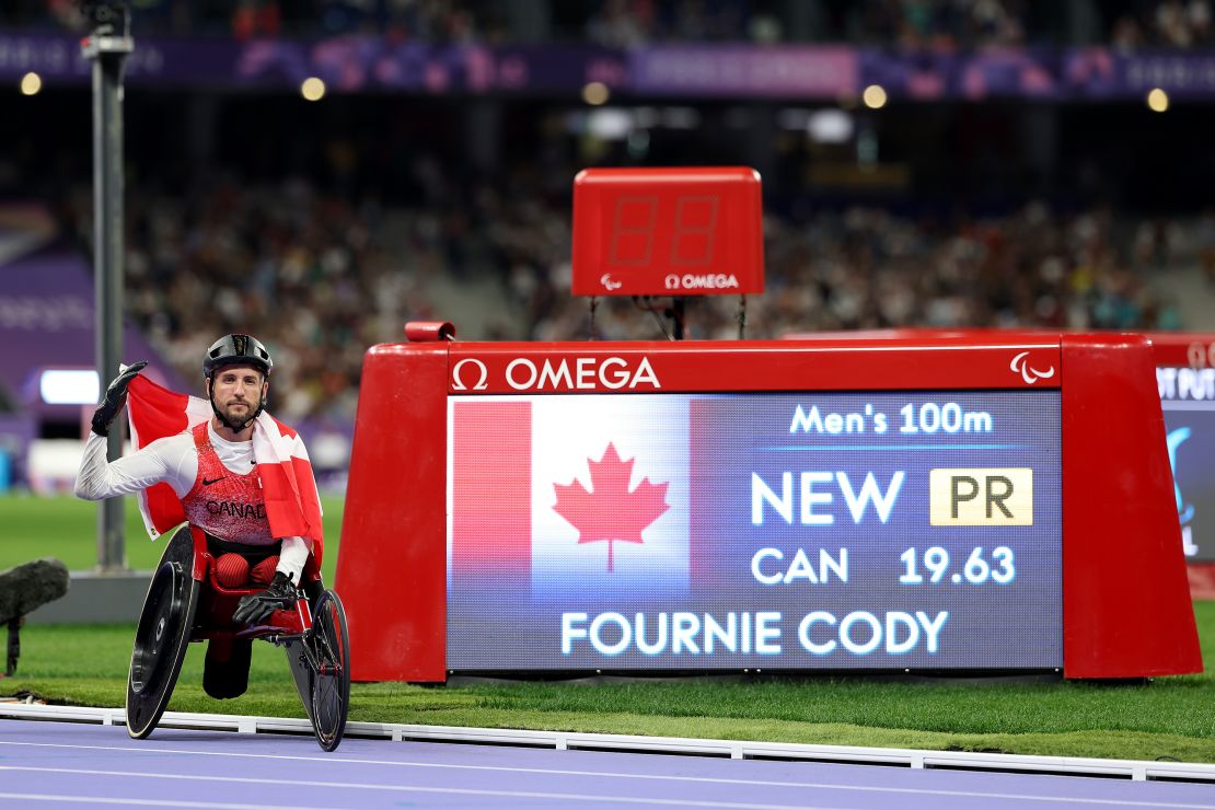 PARIS, FRANCE - SEPTEMBER 06: Cody Fournie of Team Canada poses for a photo with a Canada flag after winning gold and setting a new Paralympic Record on day nine of the Paris 2024 Summer Paralympic Games at Stade de France on September 06, 2024 in Paris, France. (Photo by Ezra Shaw/Getty Images)