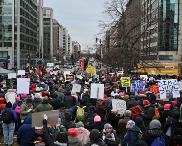 Thousands converge on Washington for a march days before Trump takes office