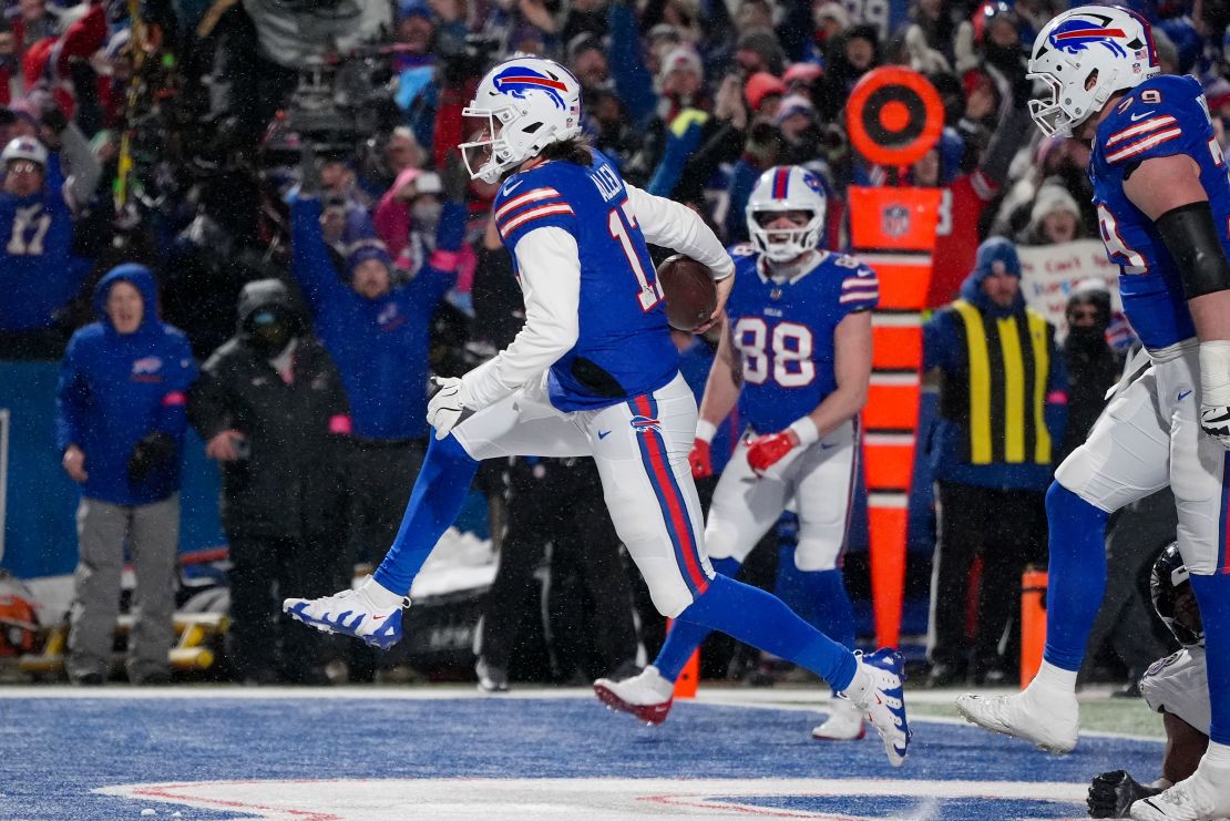 Buffalo Bills quarterback Josh Allen carries the ball into the end zone to score a touchdown against the Baltimore Ravens during the second quarter.