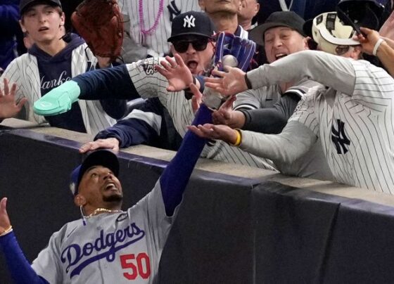 Yankees fans who interfered with Mookie Betts during World Series banned from all MLB games | CNN