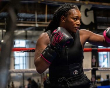 Claressa Shields, 29, left, stands next to Danielle Perkins, 42, during an open media workout in January.