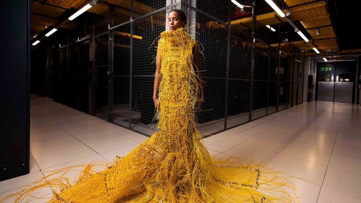 ‘Somewhat robot, somewhat human’: designer used 12,000ft fiber optic cable to weave a striking 50lb dress that will turn heads – and no, you can’t buy it