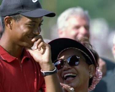 This 2018 photo shows Kultida Woods, mother of Tiger Woods, watching him play during the first round of the 2018 Masters Tournament at Augusta National Golf Club in Augusta, Georgia.