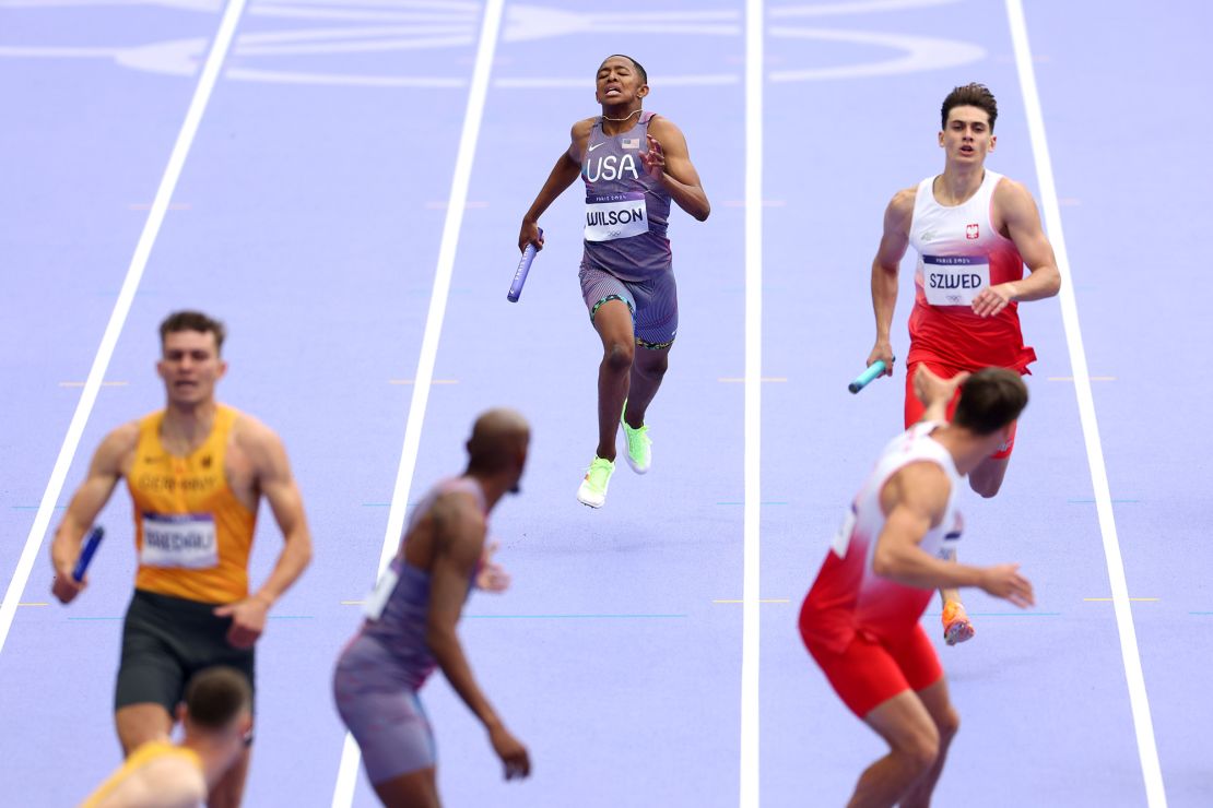 Wilson prepares to hand over the baton at the Paris Olympics.