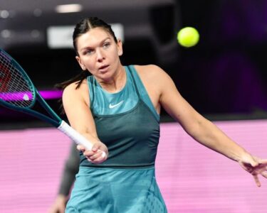 Halep celebrates winning the Wimbledon title in 2019.