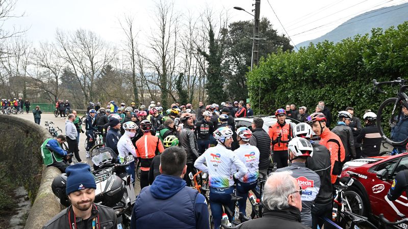 Cycling race upended by riders’ mass protest after cars on the course prompts chaos | CNN