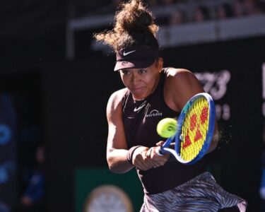 Naomi Osaka receives medical attention during her women's singles match against Switzerland's Belinda Bencic.