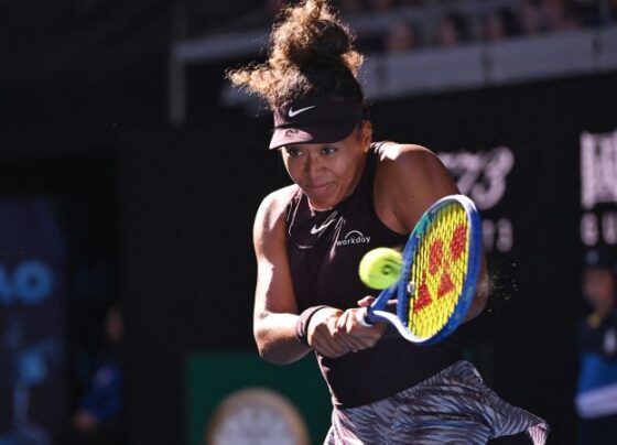 Naomi Osaka receives medical attention during her women's singles match against Switzerland's Belinda Bencic.