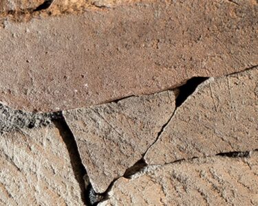 The runic stone is visible in a section of excavations.