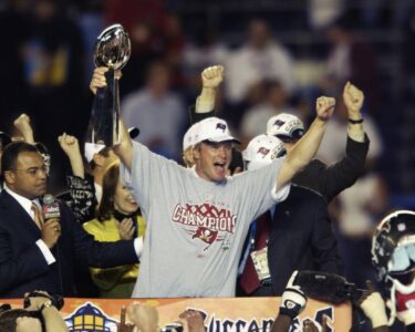 Las Vegas Raiders head coach Jon Gruden smiles on the sidelines during a game against the Miami Dolphins at Allegiant Stadium on September 26, 2021 in Las Vegas, Nevada.