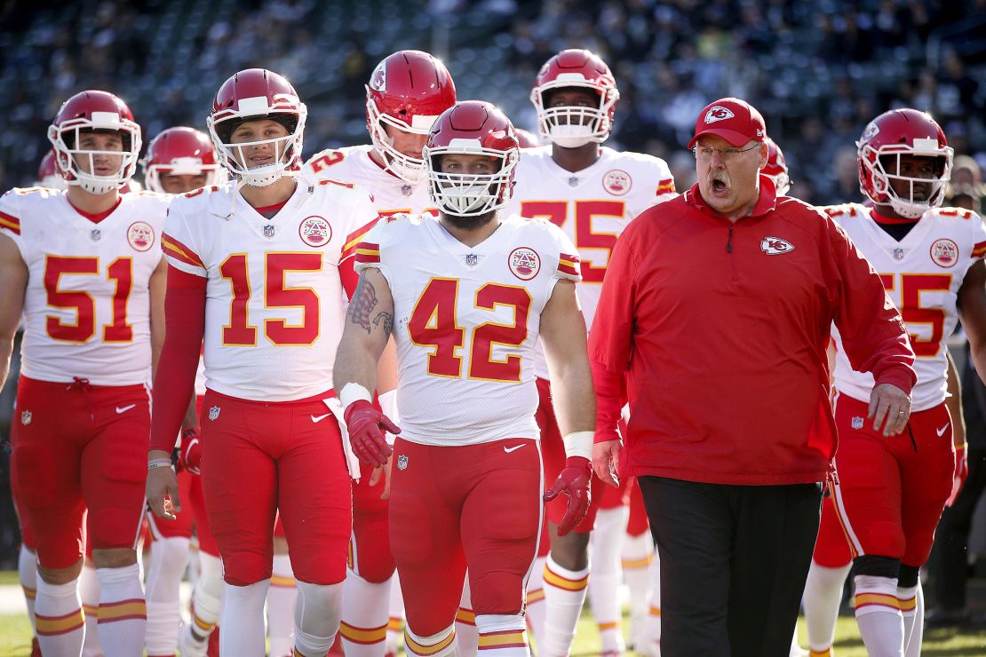 Chiefs head coach Andy Reid leads the 2018 Chiefs onto the field before the start of a game against the Raiders.