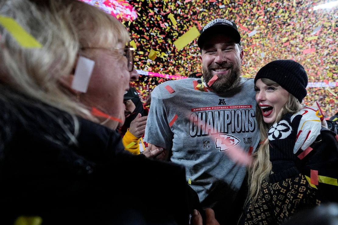 Donna Kelce stands with her son Travis Kelce and Taylor Swift after the AFC championship game against the Buffalo Bills.